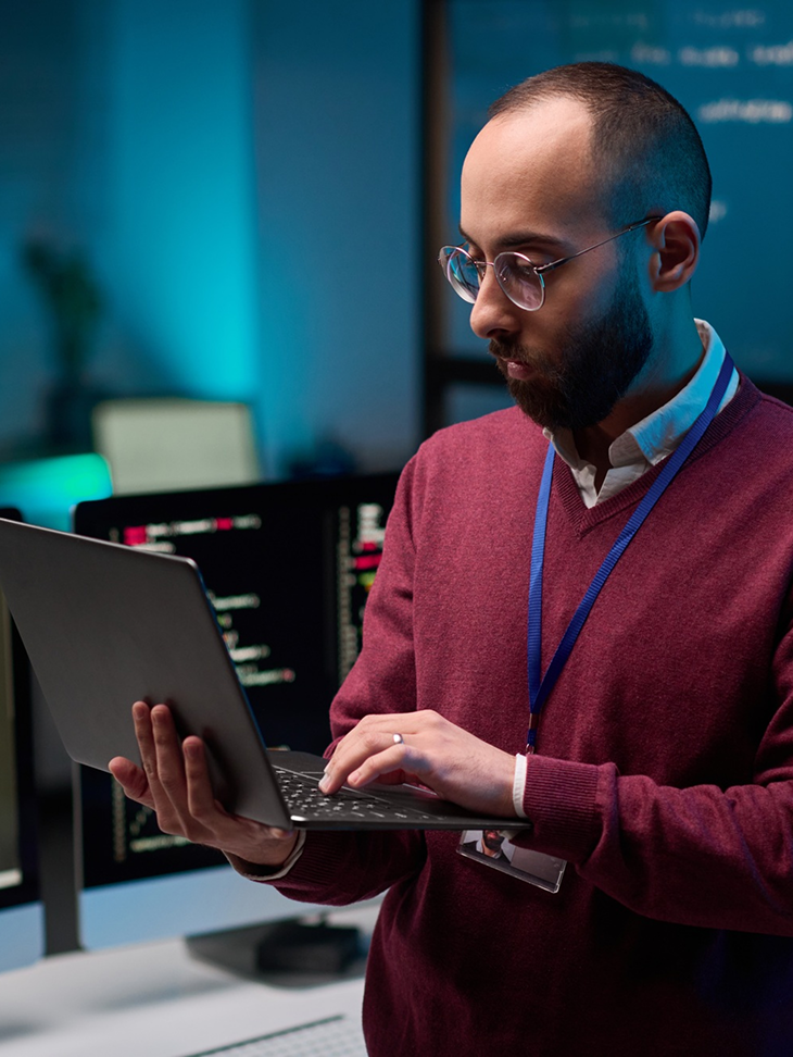 man holding a laptop